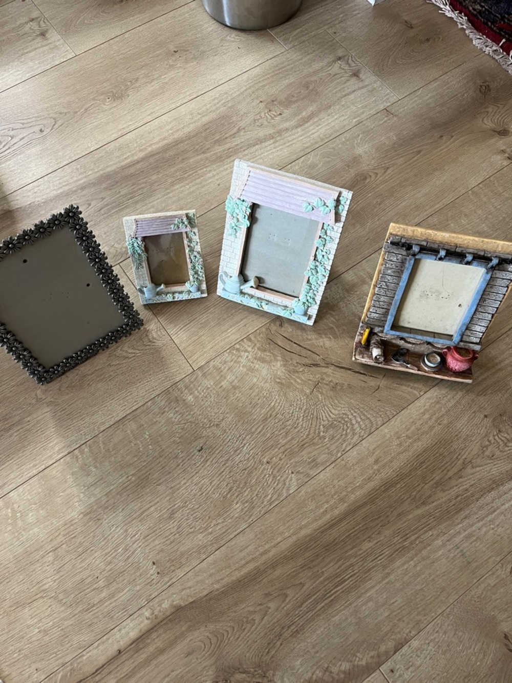 Set of Four Decorative Picture Frames in White, Cream, Black, and Brown Tones